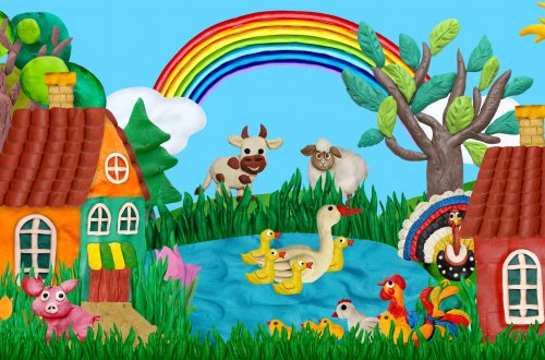 summer village banner with farm animals houses sculptures